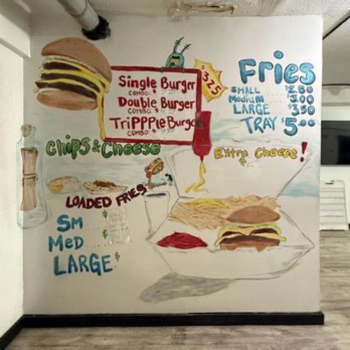 The hand-painted menu wall at Wishes with burgers, fries, chips and cheese and loaded fries